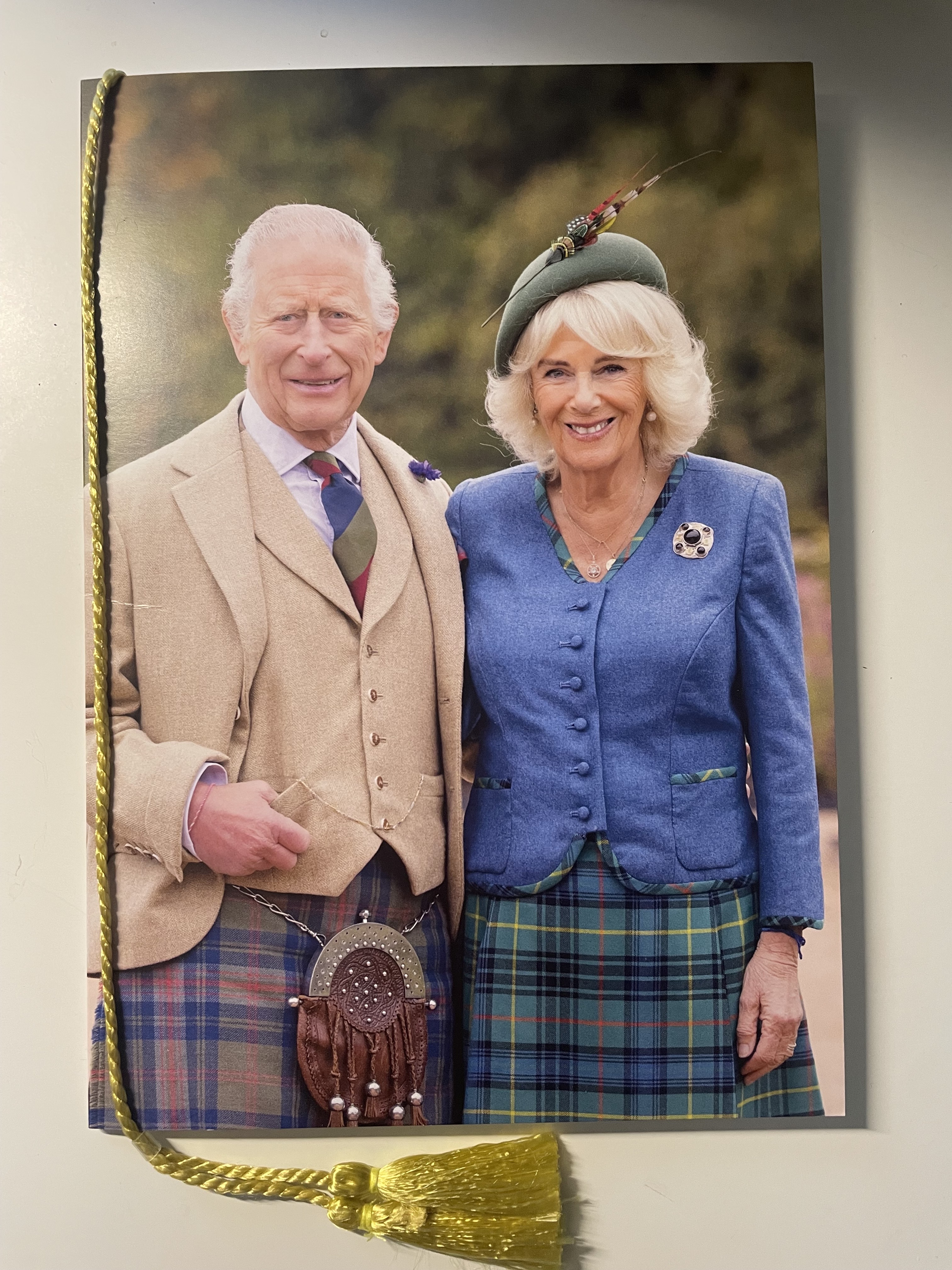 Congratulatory birthday card from King Charles III and Queen Camilla, showing the royal couple in Scottish attire